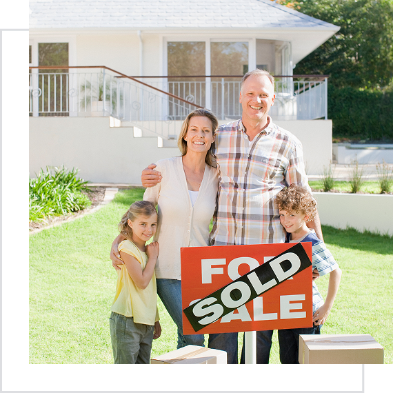 New homeowners smiling in front yard